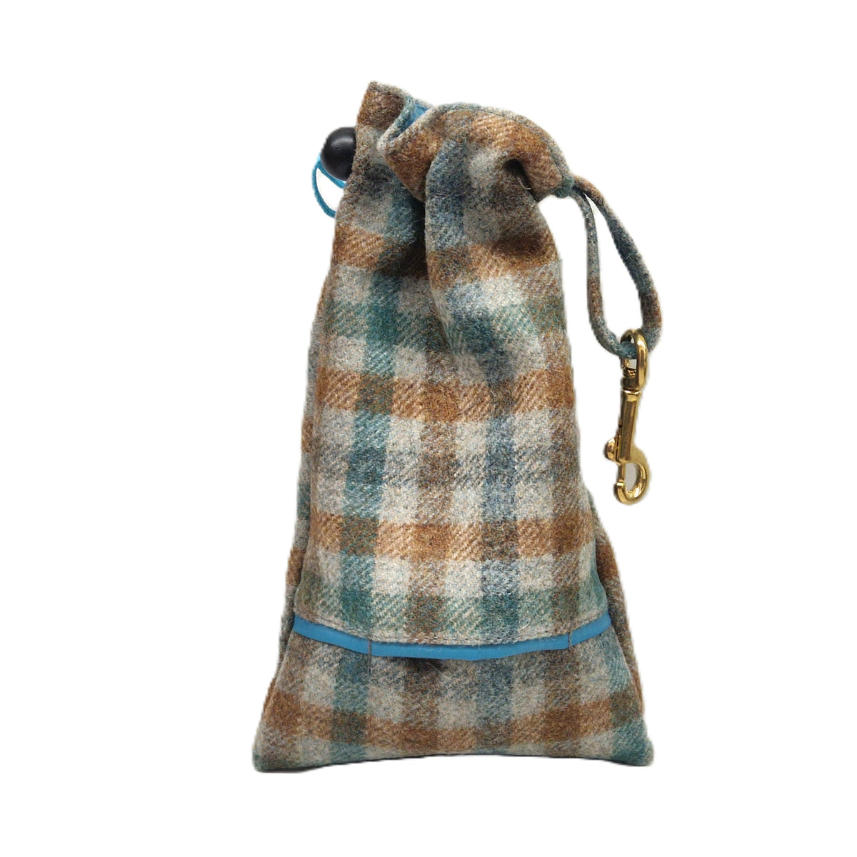 A small drawstring pouch made of plaid wool fabric in brown, beige, and teal tones, with a blue trim detail and a gold-tone metal clip on a white background.