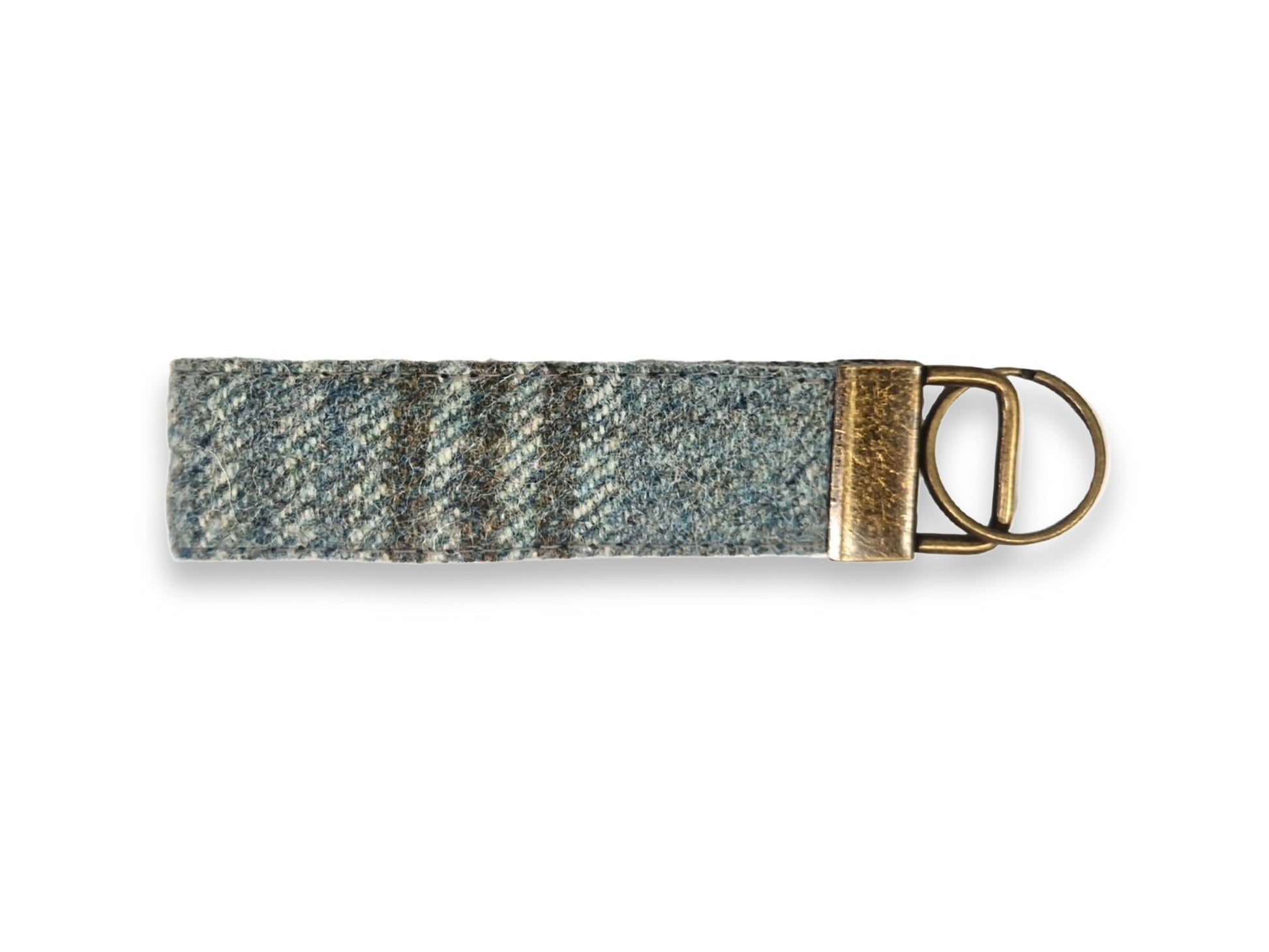 Woven tweed keyring with a metal ring on a white background