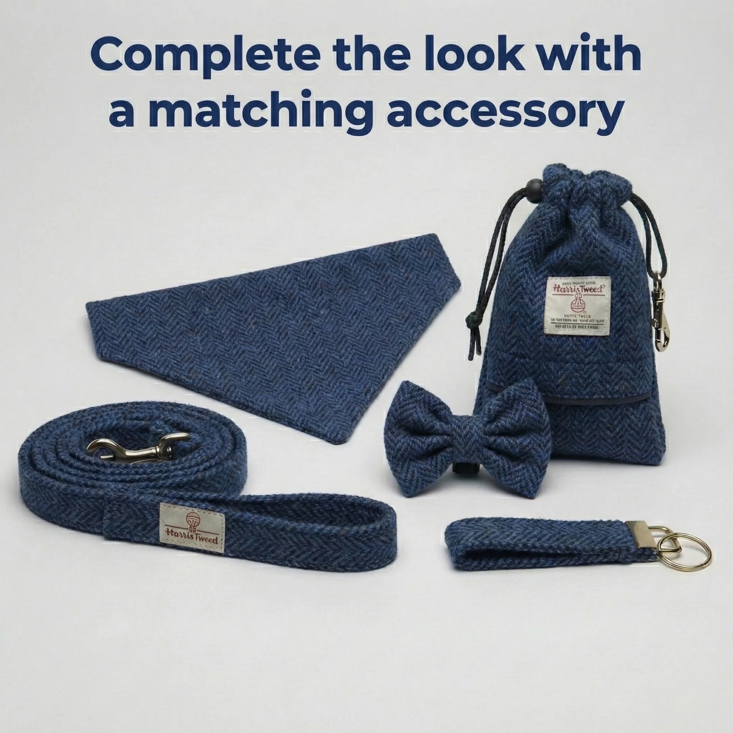Set of blue dog accessories including a leash, bow tie, and pouch on a white background.