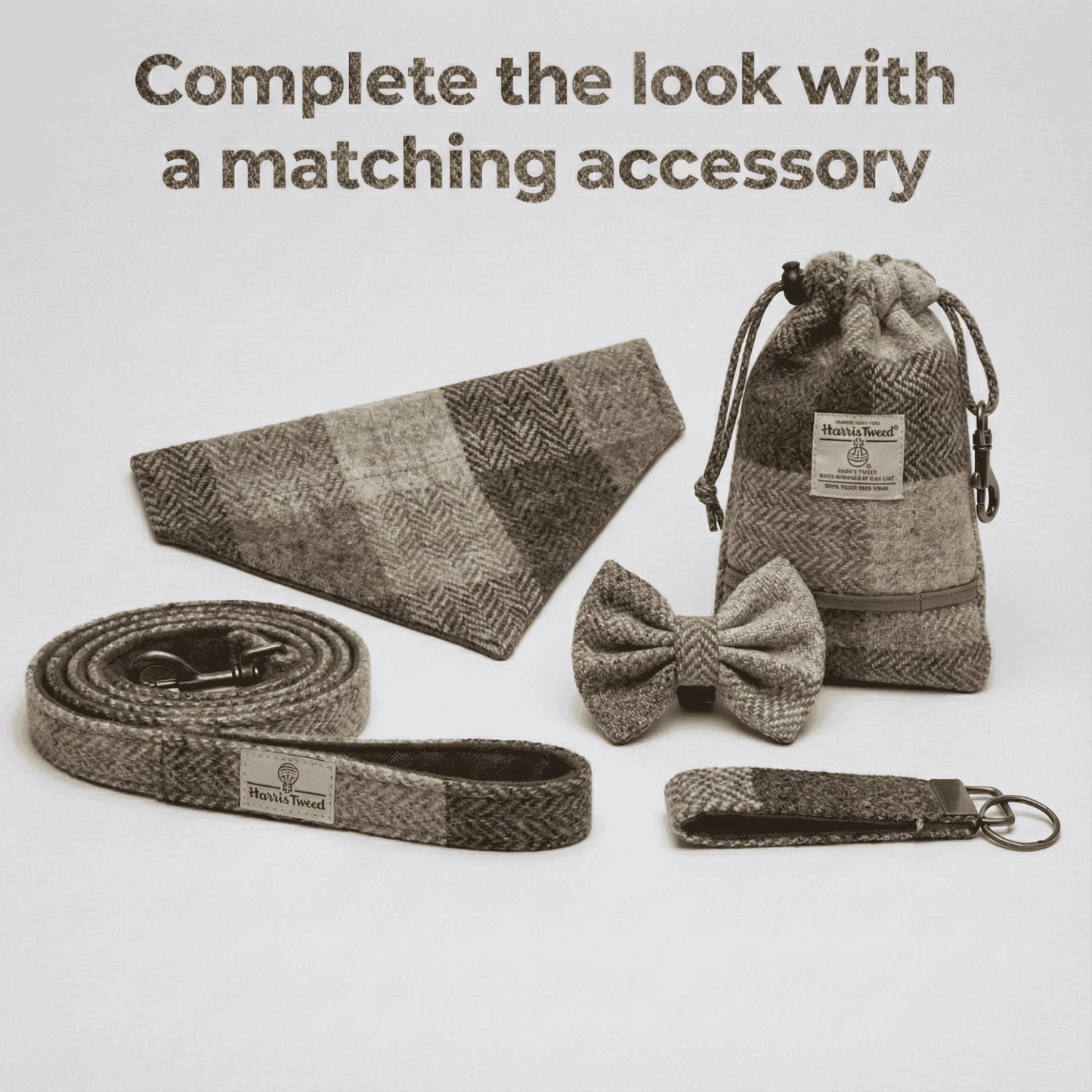 Set of herringbone patterned accessories including a bow tie, belt, keychain, and pouch on a light gray background.