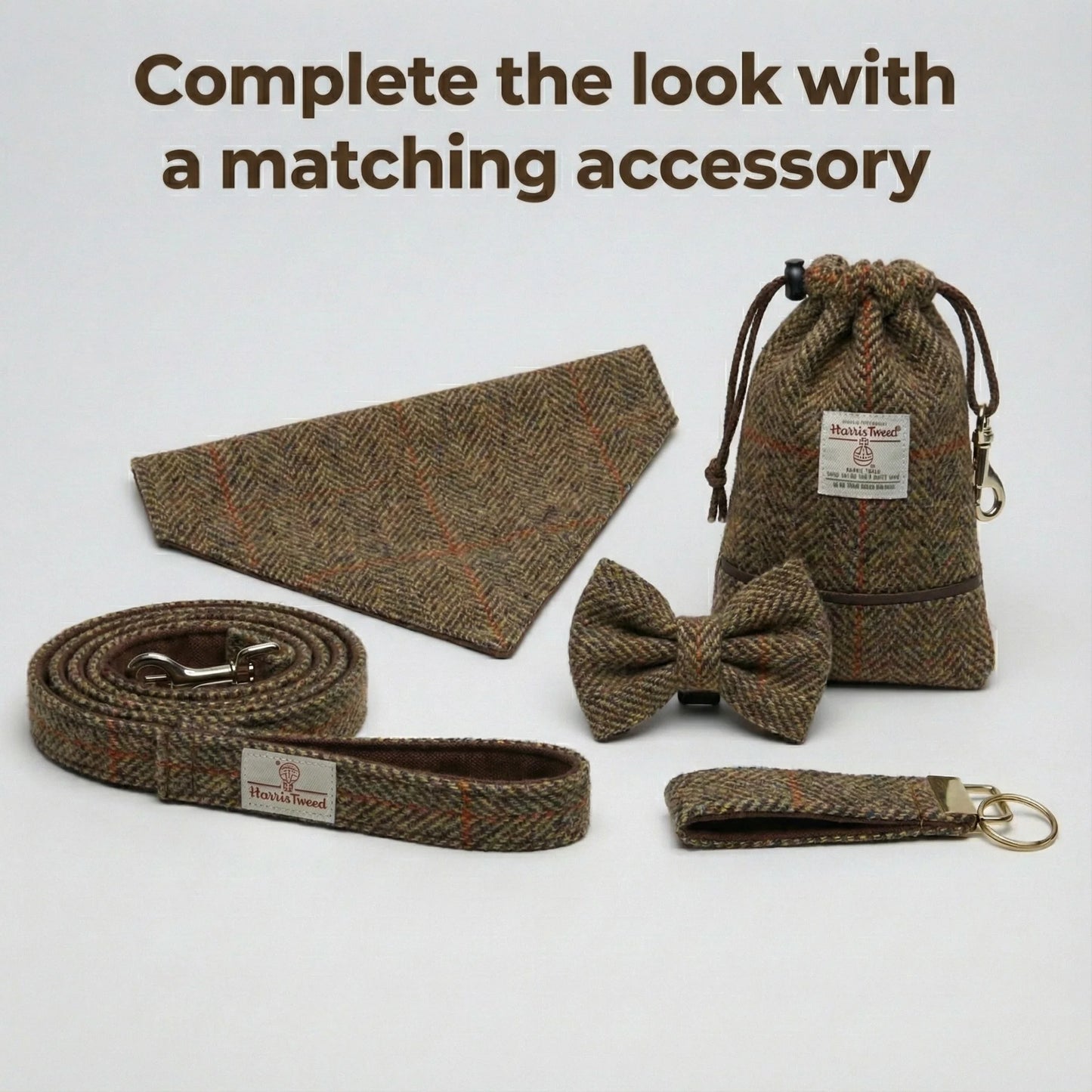 Set of brown herringbone accessories including a bow tie, dog leash, and pouch on a light gray background.