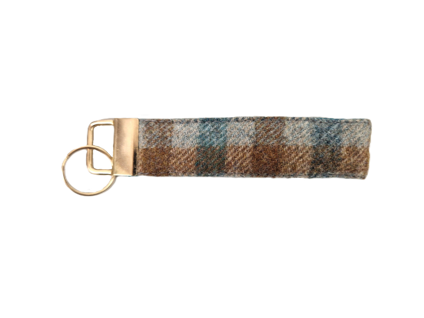 A plaid wool keychain strap in brown, beige, and blue tones, finished with a brass metal loop and split ring.