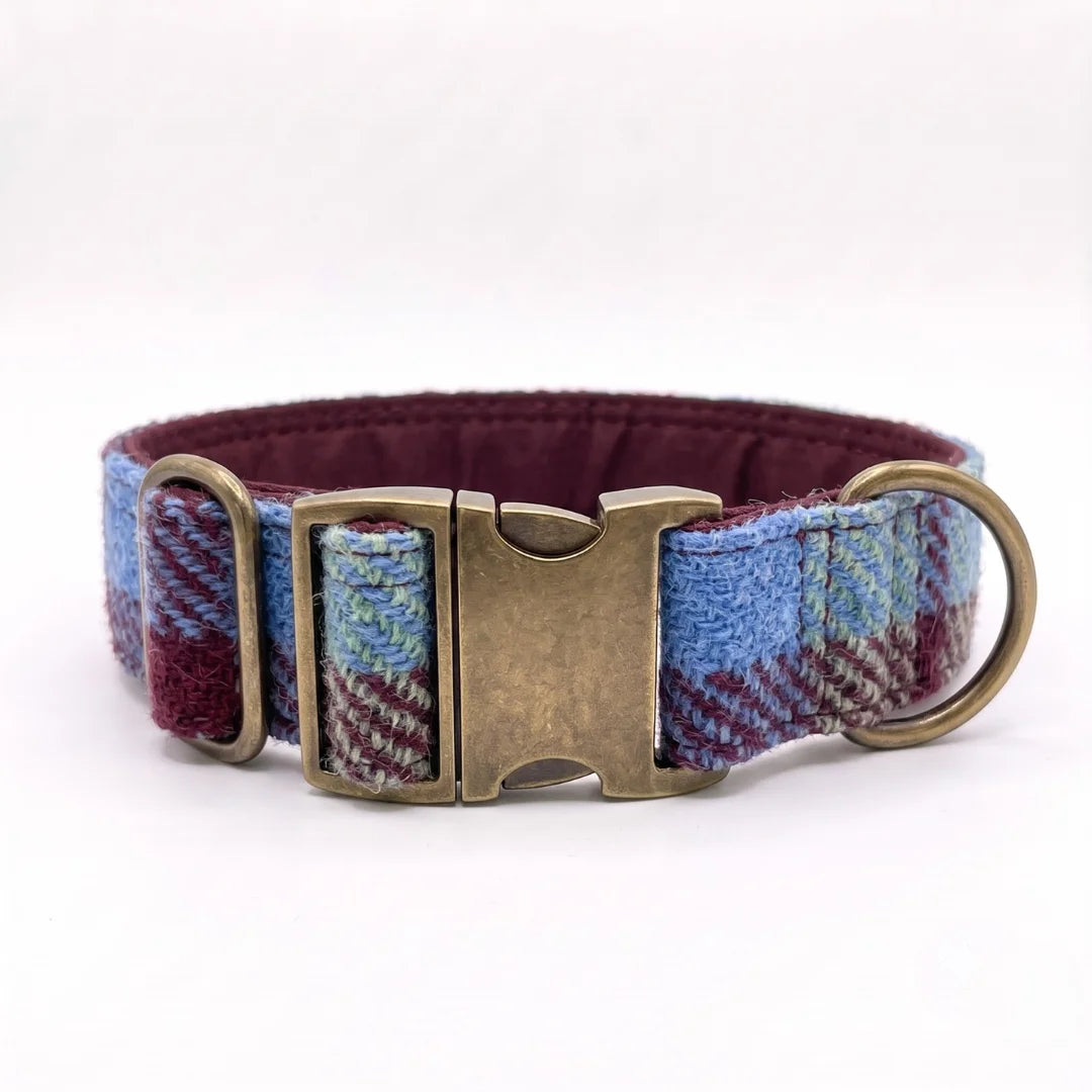 A woven fabric dog collar with a blue, burgundy, and white plaid pattern, featuring an antique bronze metal buckle and hardware, shown on a white background.