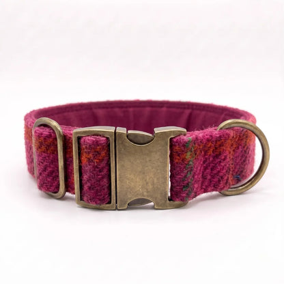 An extra wide 38mm harris tweed dog collar in a textured magenta and orange plaid pattern, featuring an antique bronze metal buckle and D-ring, shown on a plain white background.