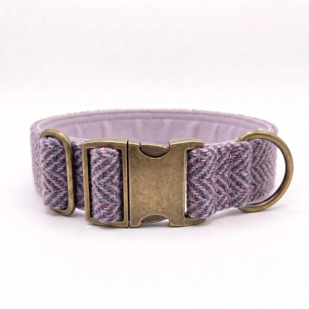 38mm wide harris tweed herringbone dog collar in a purple and blue herringbone pattern with an antique bronze buckle and a brass ring, shown on a white background.