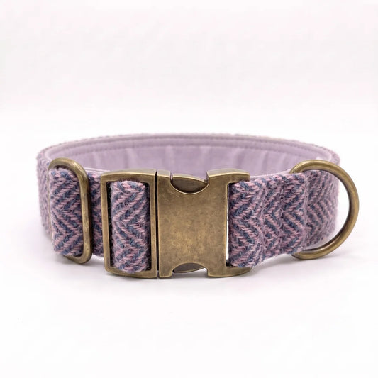 38mm wide harris tweed herringbone dog collar in a purple and blue herringbone pattern with an antique bronze buckle and a brass ring, shown on a white background.
