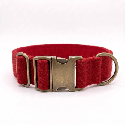 A red 38mm wide harris tweed dog collar with an antique bronze metal clasp and D-ring, shown on a plain white background.