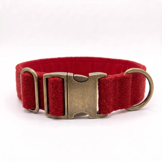A red 38mm wide harris tweed dog collar with an antique bronze metal clasp and D-ring, shown on a plain white background.