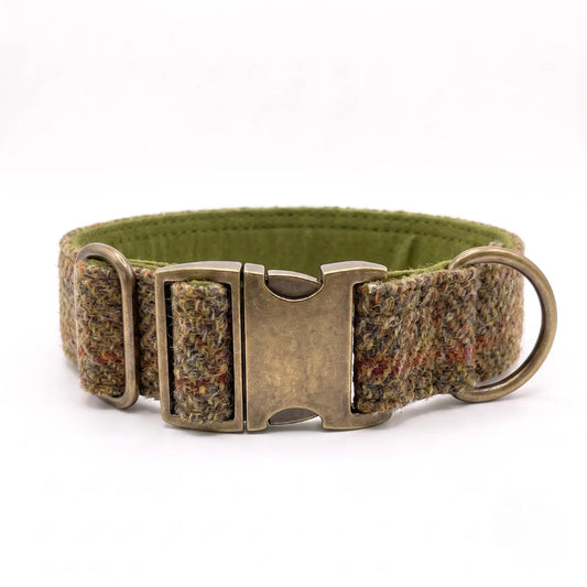 A woven dog collar in a multicolor tweed pattern with an olive green inner lining, featuring an antique bronze metal buckle and a matching metal ring, shown on a white background.