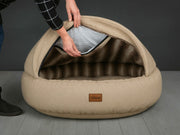 Demonstration of inserting the foam into the hood of the Beige Deluxe Cocoon Dog Bed by Collared Creatures