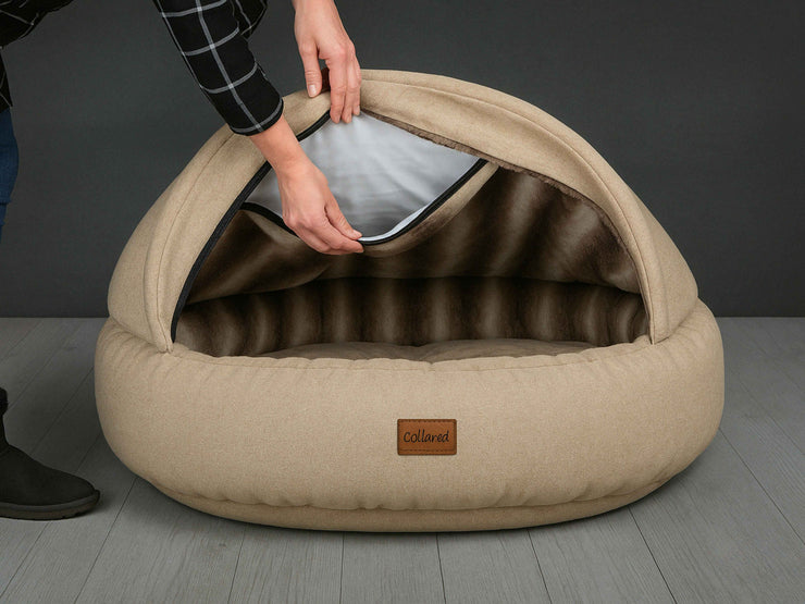 Demonstration of inserting the foam into the hood of the Beige Deluxe Cocoon Dog Bed by Collared Creatures
