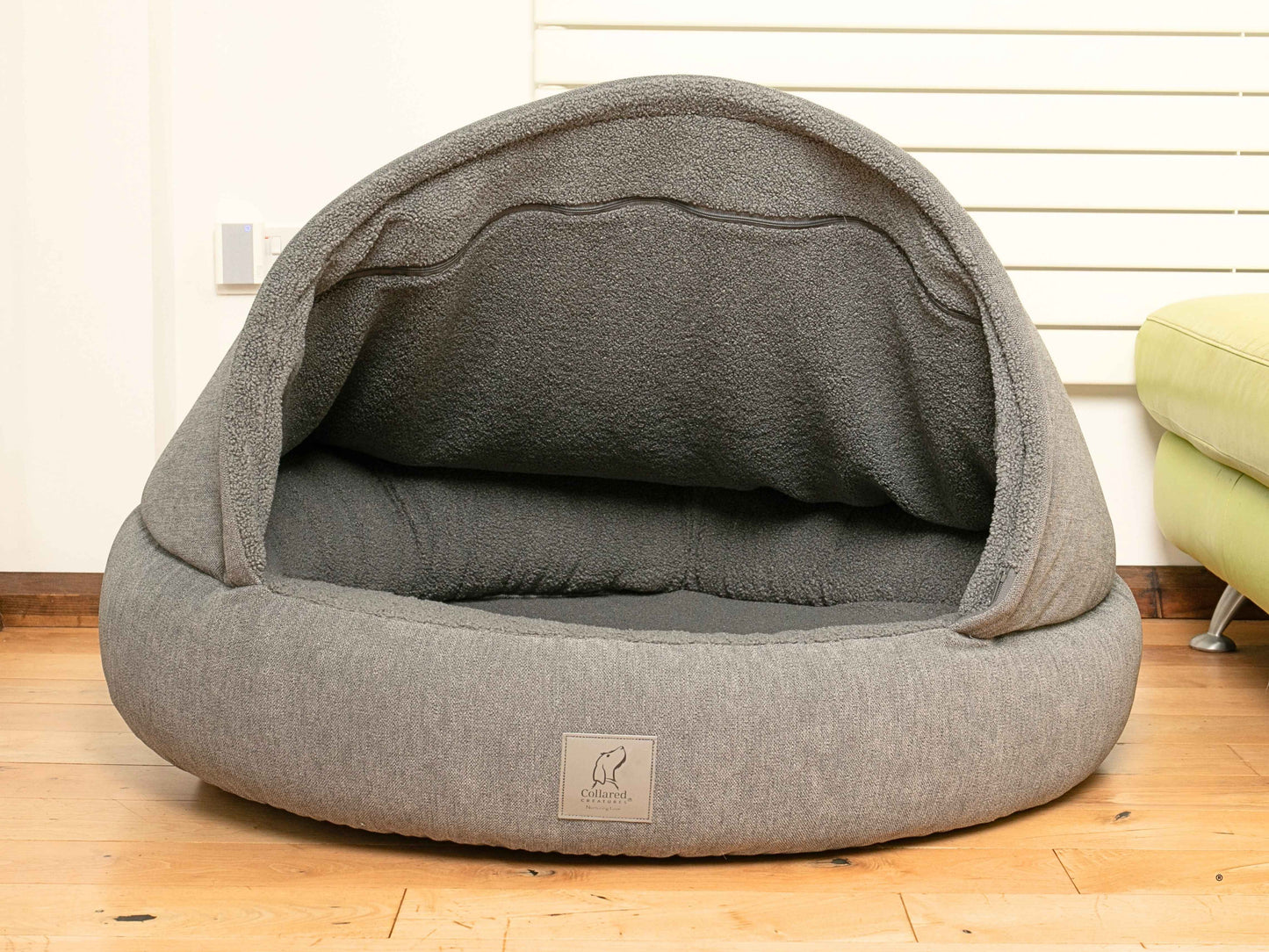Empty collared creaturesgrey deluxe cocoon dog bed showing teddy fleece-lined interior and padded bolster