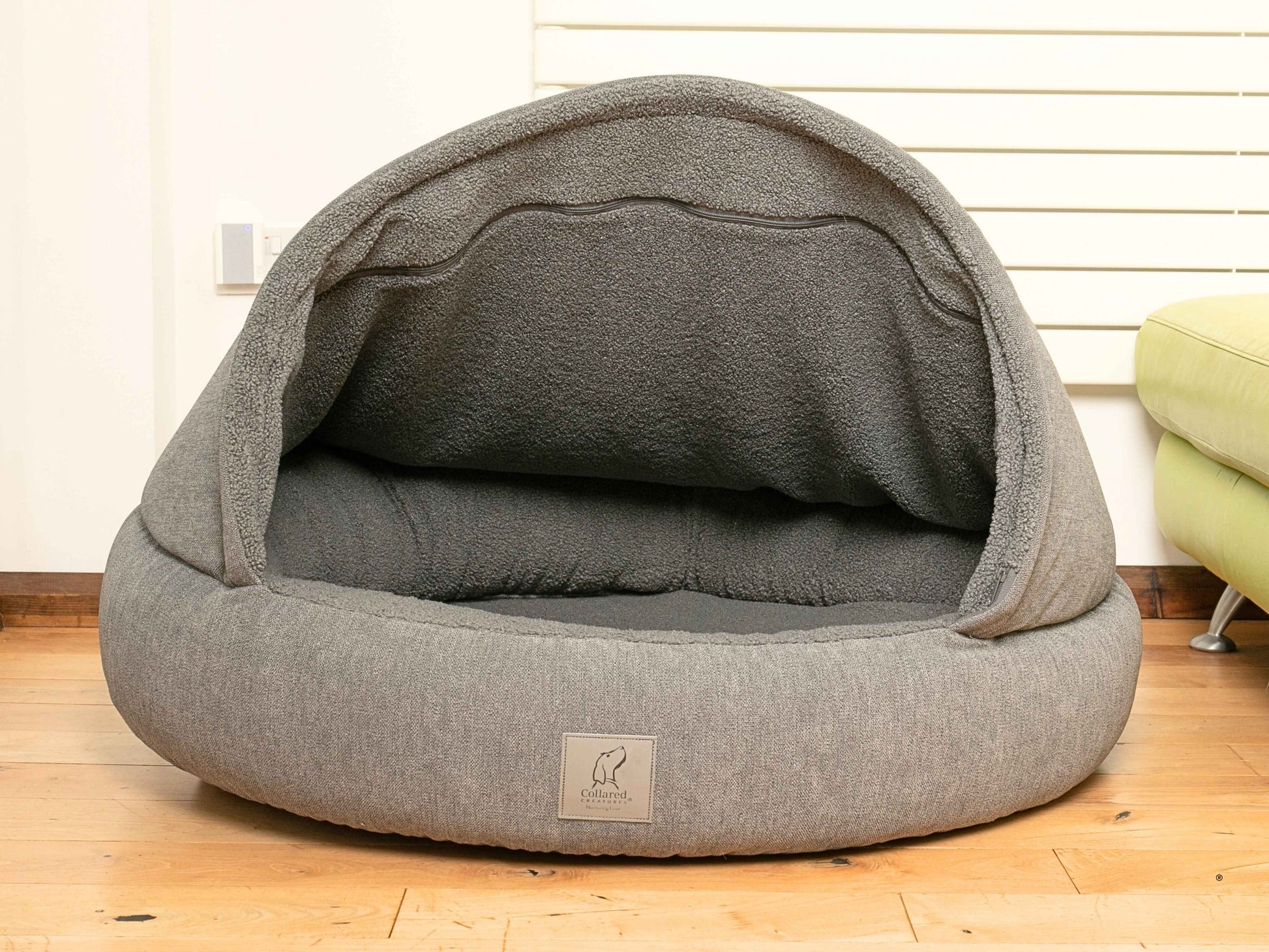 Empty collared creaturesgrey deluxe cocoon dog bed showing teddy fleece-lined interior and padded bolster