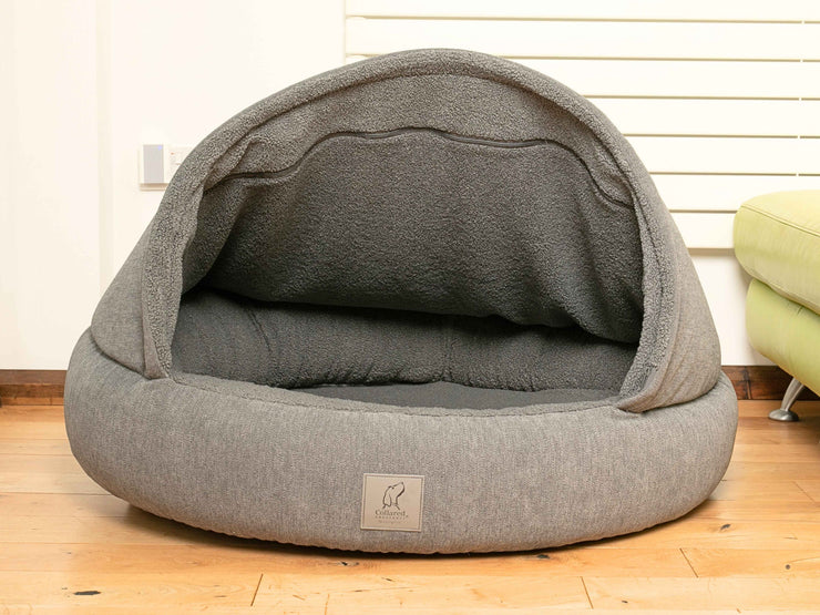Empty collared creaturesgrey deluxe cocoon dog bed showing teddy fleece-lined interior and padded bolster