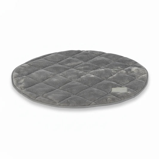 grey faux fur round dog mat on white background