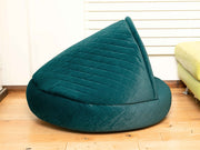 Side view of the teal quilted cocoon dog bed showing full hooded structure