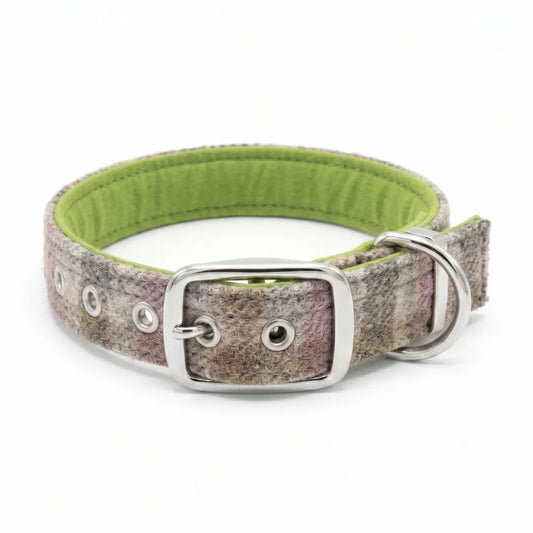 A textured woven dog collar with a speckled pattern of pink, purple, and gray, featuring a bright lime green fabric lining and silver-tone metal hardware.