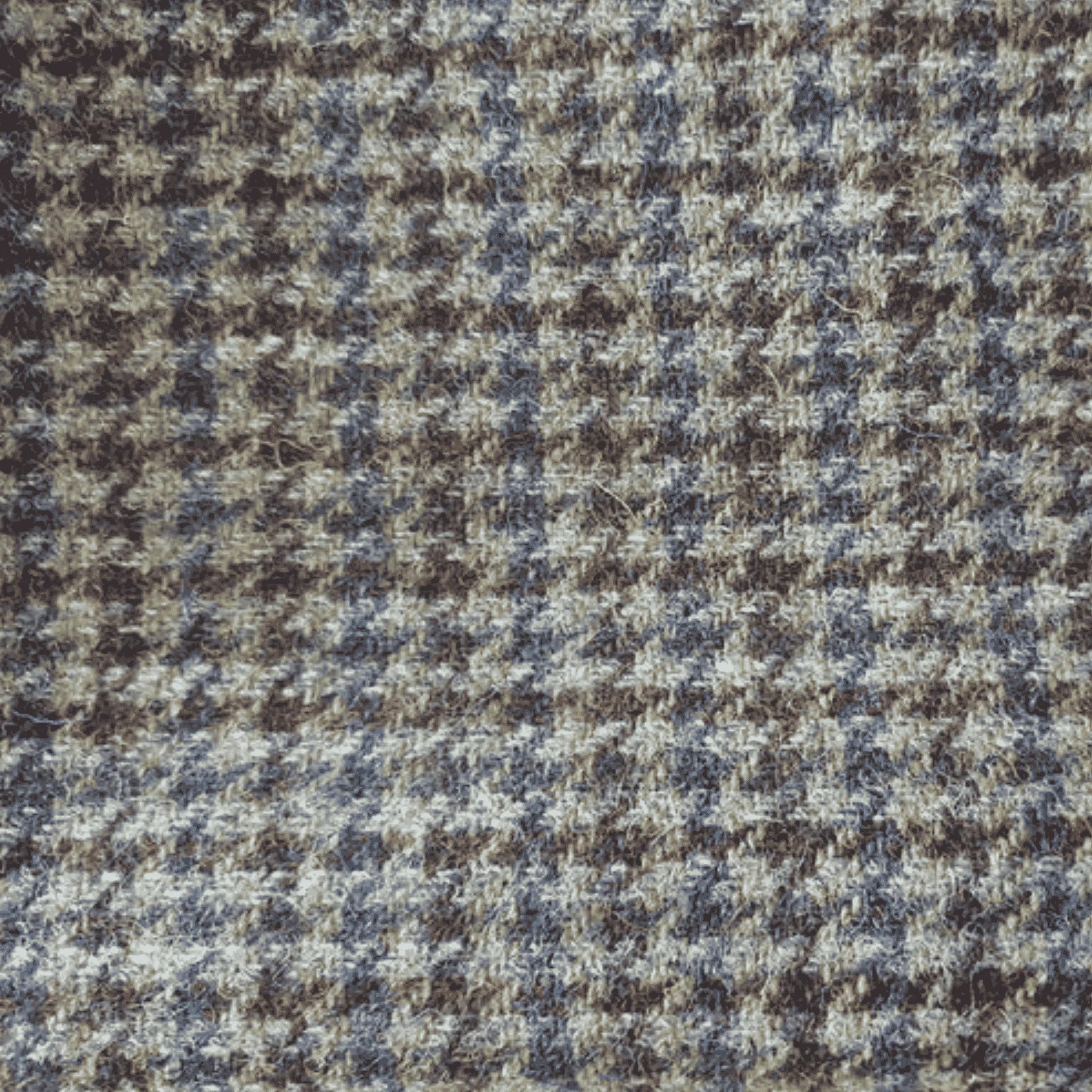 Close-up of a houndstooth pattern fabric with brown and blue colors.