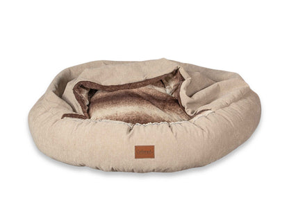 Beige cocoon dog bed shown flat with open hood and visible fleece interior made by Collared Creatures, UK