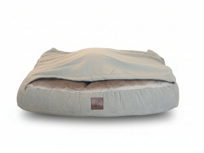 Beige hooded snuggle dog bed on white background, removable hood, studio product photo.