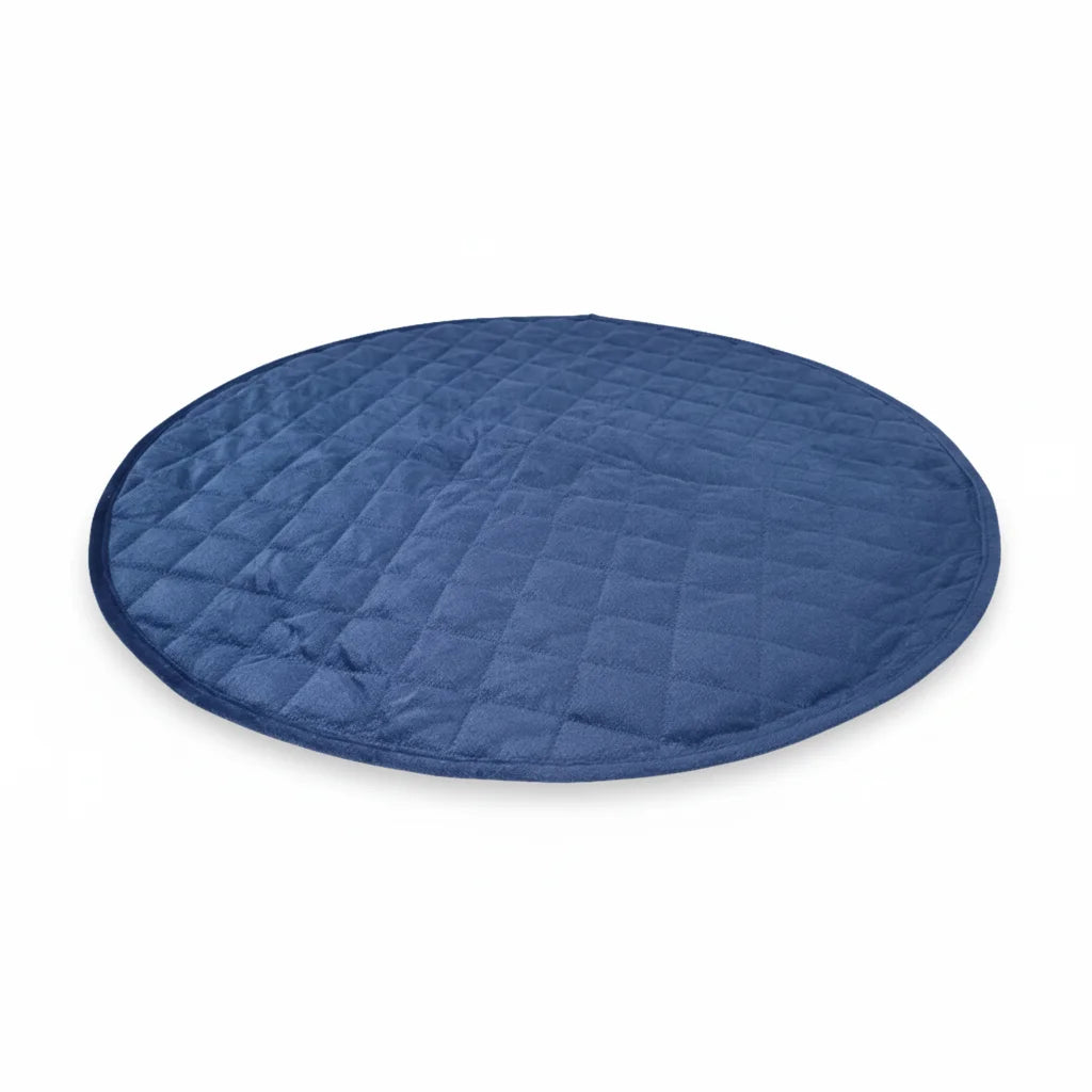 Round blue quilted dog mat on a white background