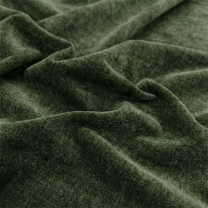 Close-up of dark green fabric with visible texture