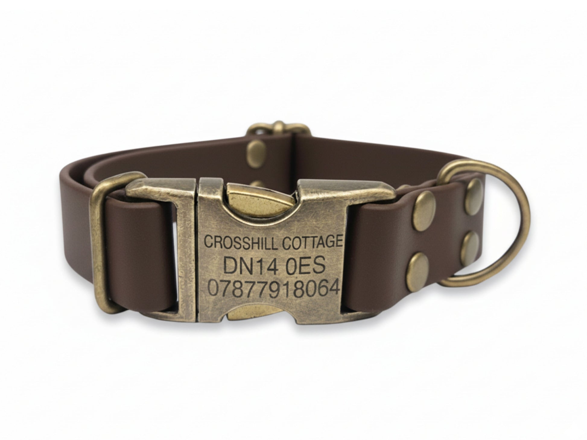 Brown biothane dog collar with antique brass buckle on a white background