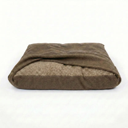 Brown snuggle bed with fixed blanket on a white background