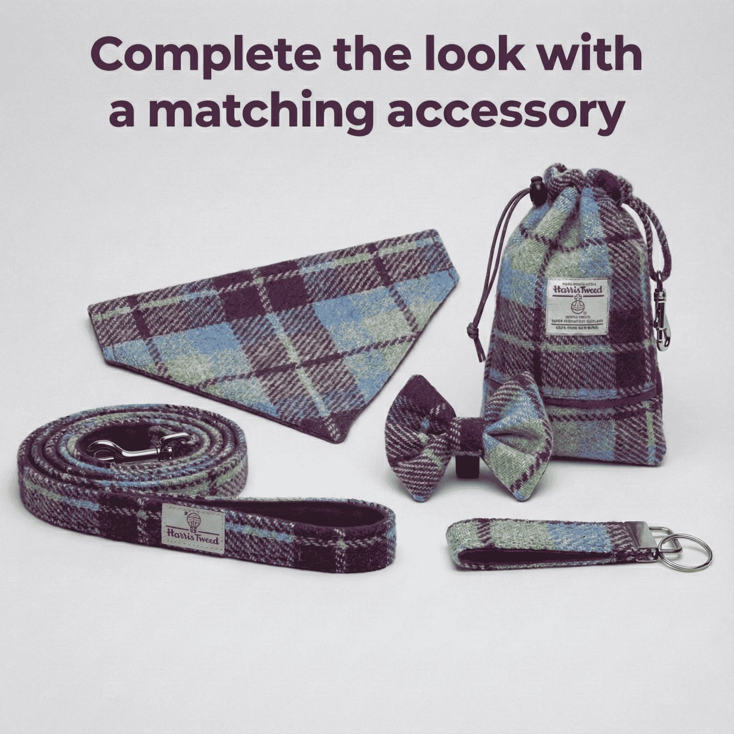 Set of plaid pet accessories including a collar, bow tie, leash, and keychain on a white background.