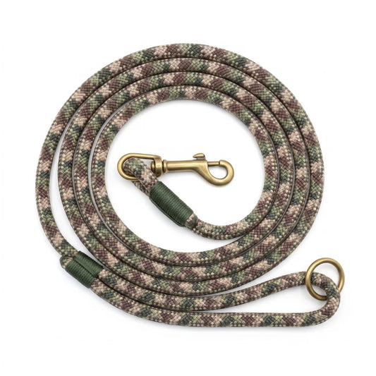 A coiled dog leash with a camouflage pattern in green, brown, and beige, featuring a brass clasp and a matching brass ring, set against a plain white background.