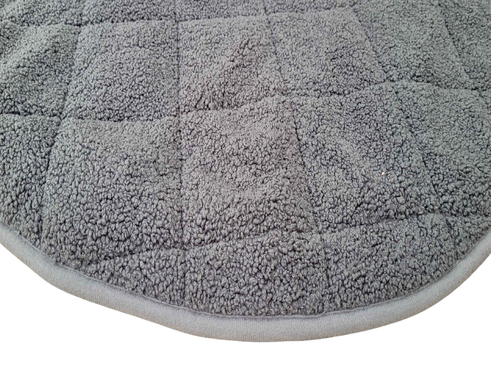 close up of grey round teddy fur dog bed blanket
