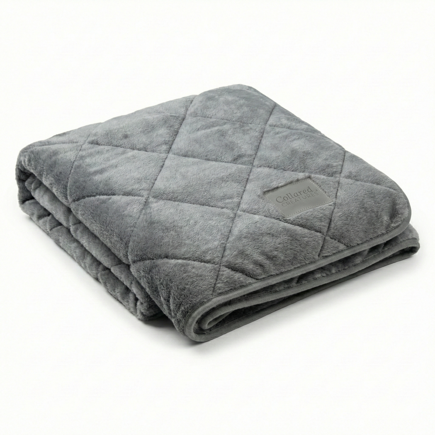 Folded gray weighted blanket on a white background