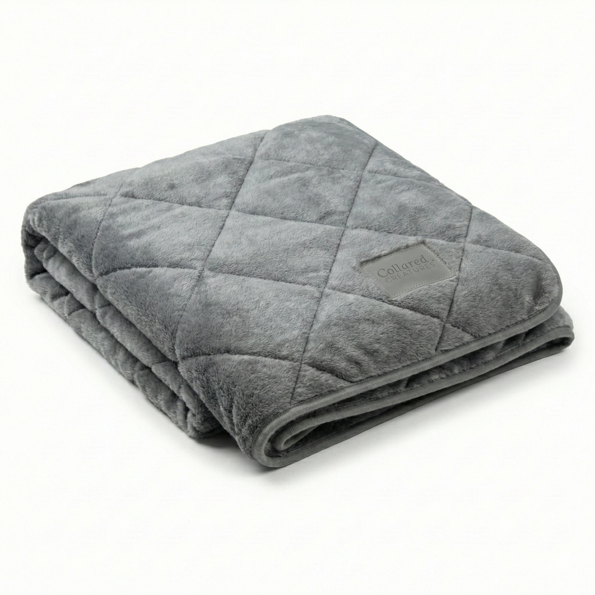 Folded gray weighted blanket on a white background