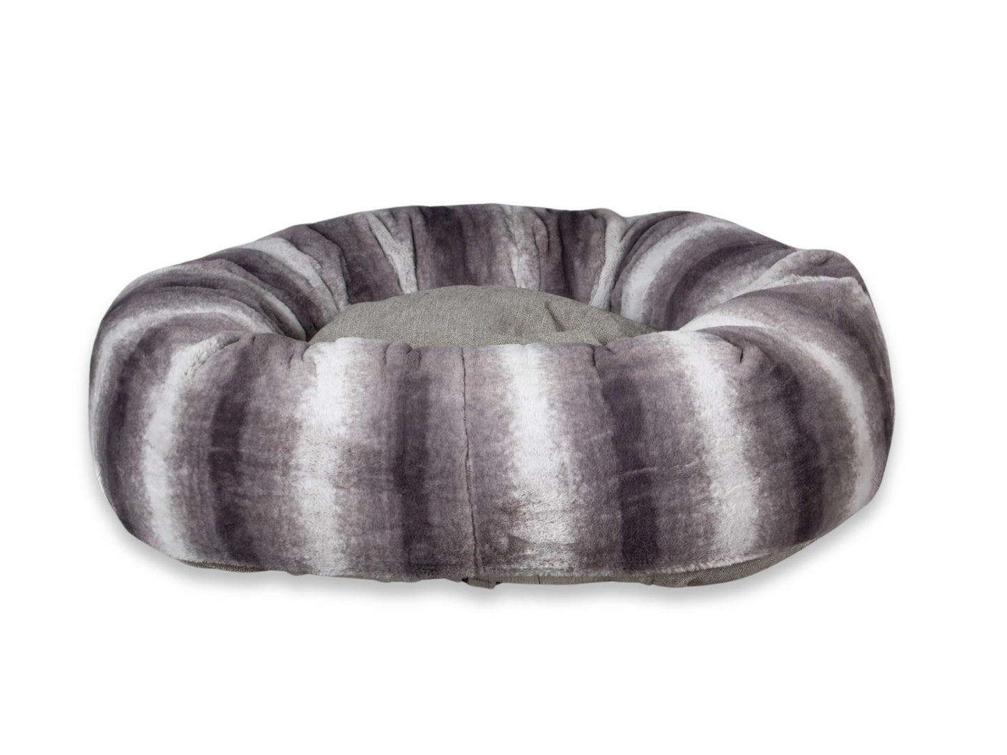 Close-up of luxury grey donut dog bed in plush faux fur finish