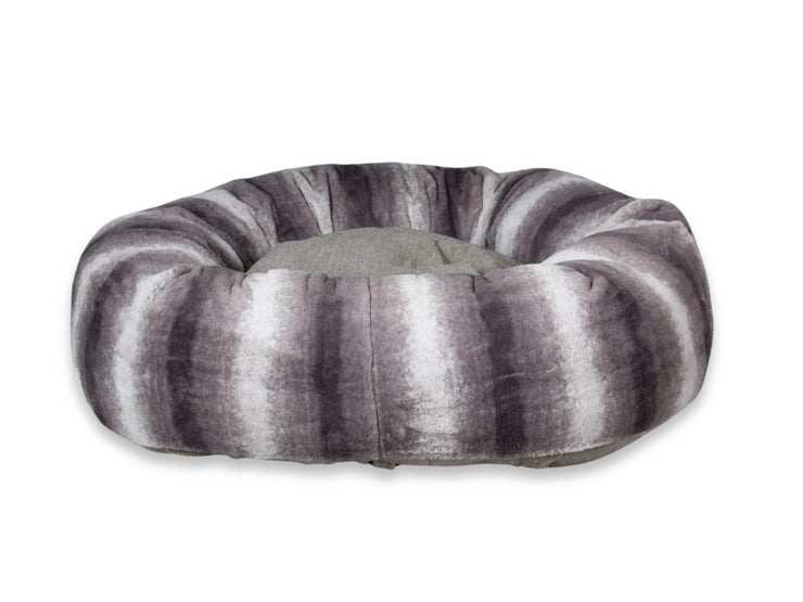Close-up of luxury grey donut dog bed in plush faux fur finish
