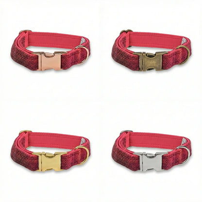 Four red dog collars with gold and silver buckles on a white background