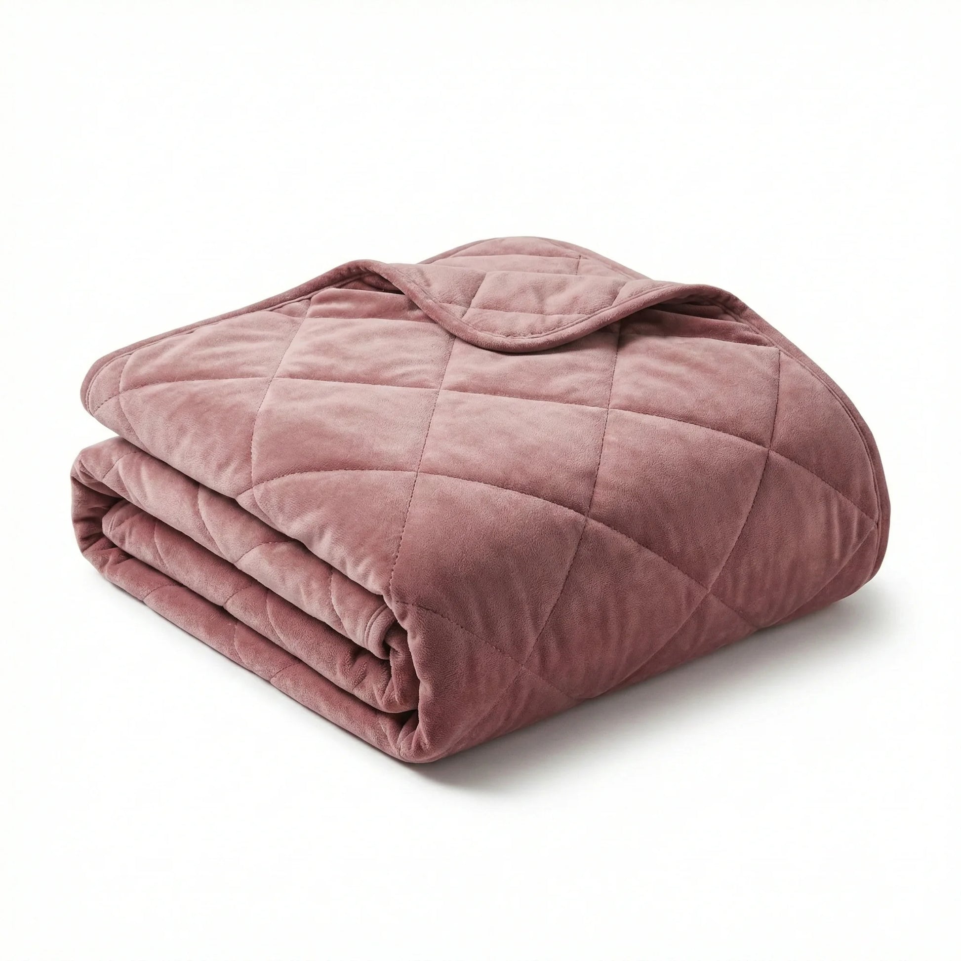 Folded pink weighted blanket on a white background