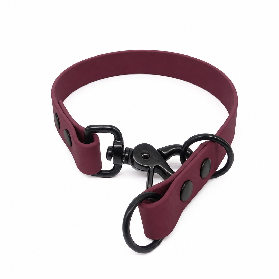 Wine biothane slip collar with black hardware, including a swivel clasp, two o-rings.