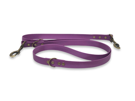 purple biothane training lead with dual clips on white background