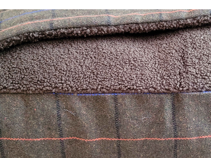 Close-up of Green Tweed Snuggle Bed showing soft teddy fleece lining