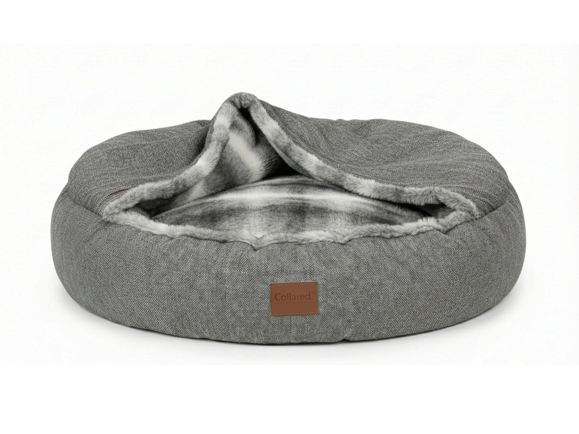 grey covered dog bed on white background