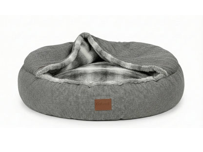 grey covered dog bed on white background