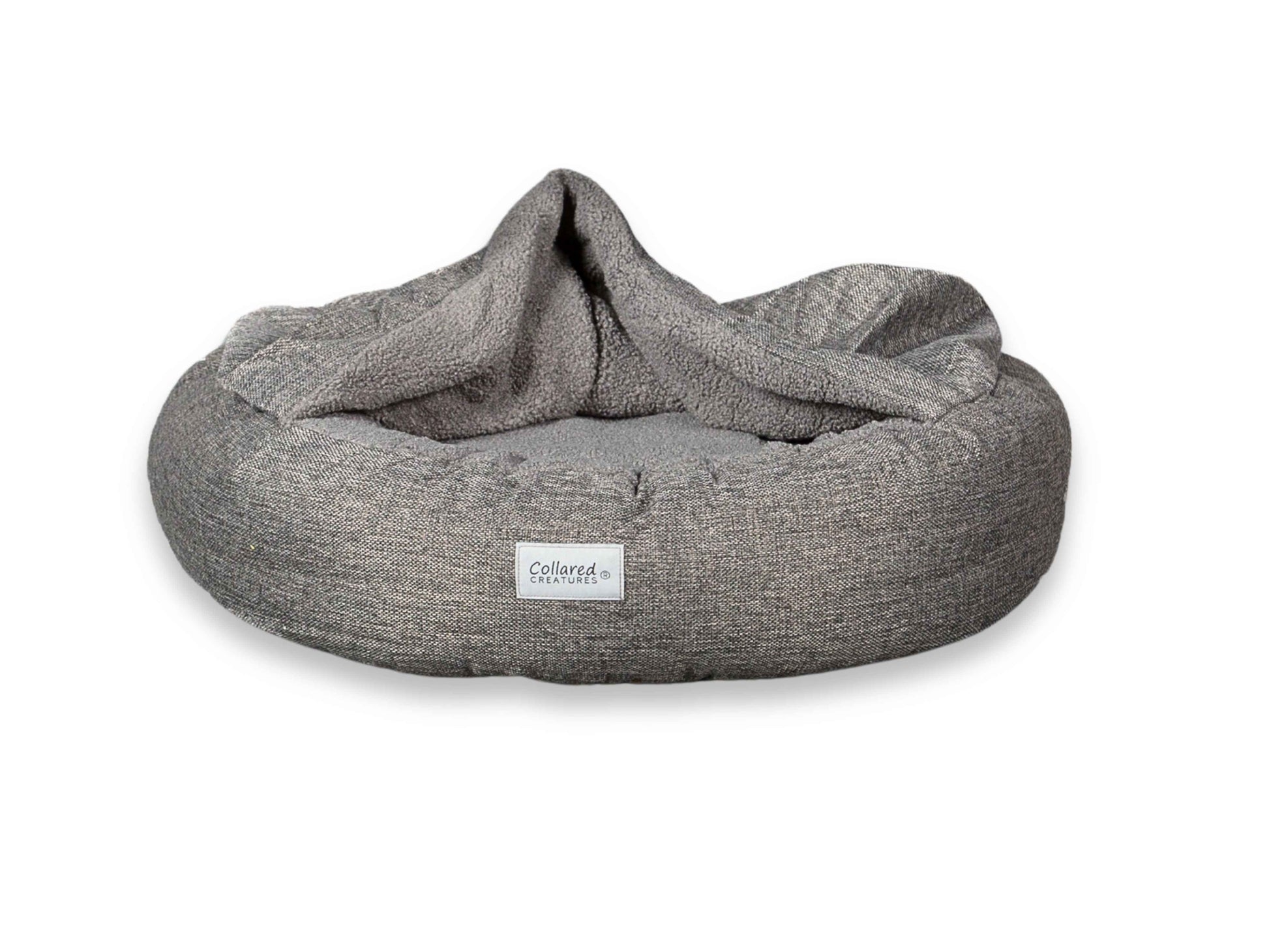 Grey Collared Creatures Cocoon Dog Bed against white background, hood open