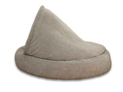 Side angle of the grey cocoon bed showing full coverage hood and bolster design