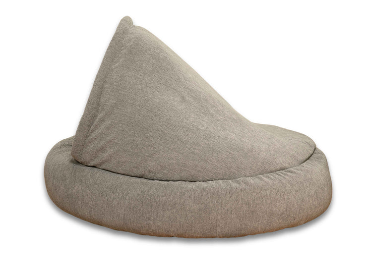 Side angle of the grey cocoon bed showing full coverage hood and bolster design