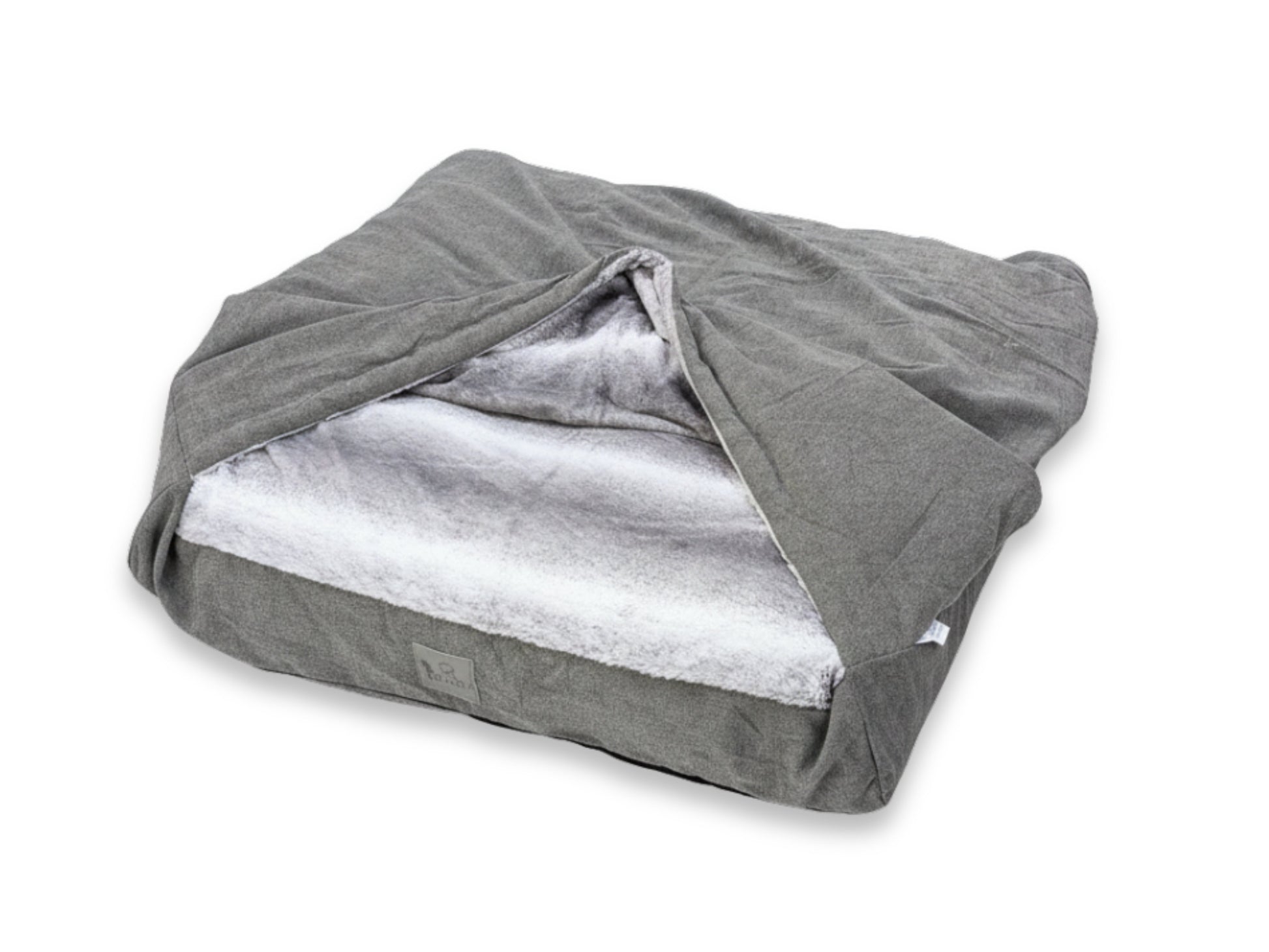 Grey snuggle bed for dogs with soft fleece lining and fold-over cover, shown empty to highlight design and comfort