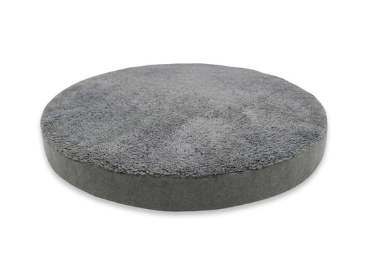 Round gray dog cushion on a white background