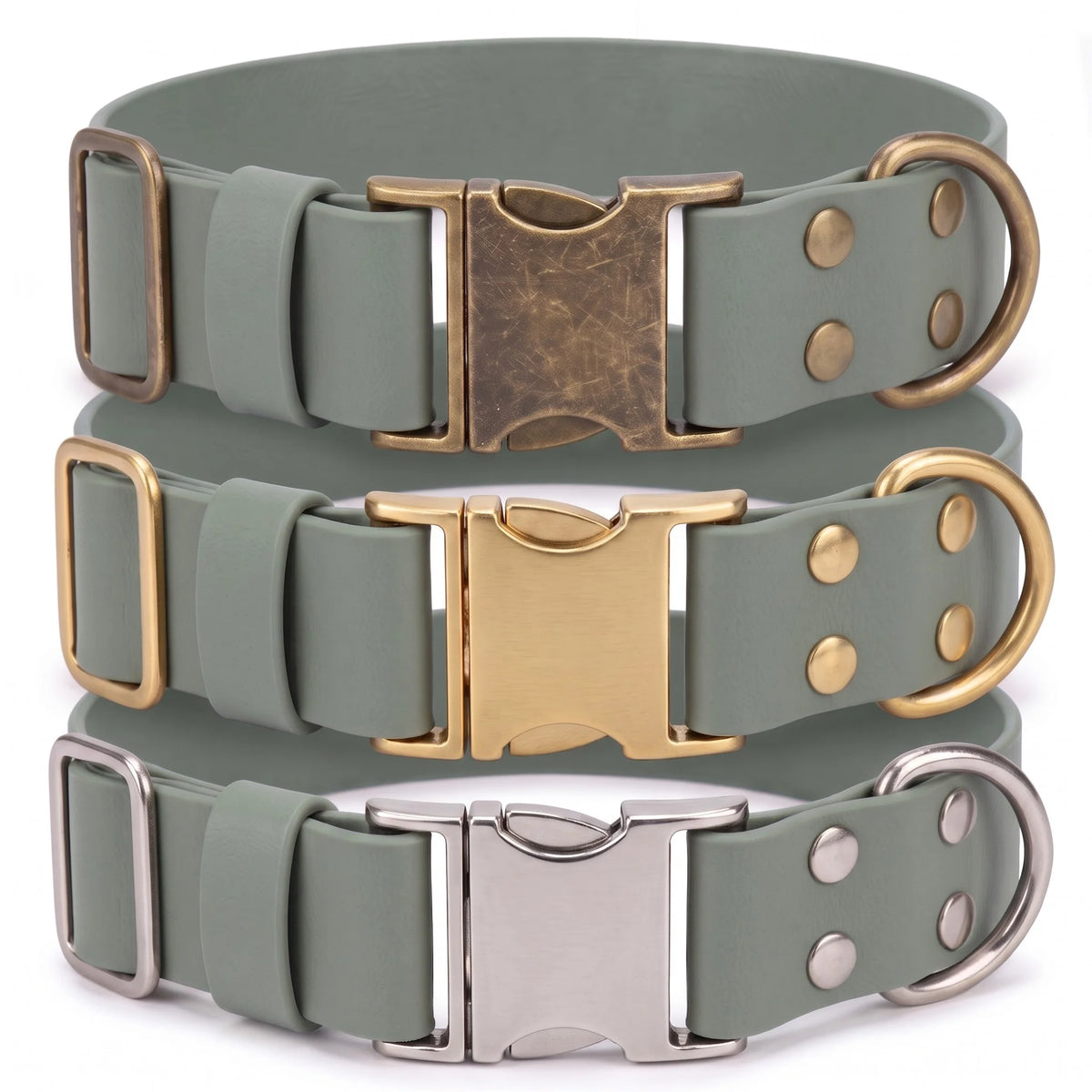 Three adjustable dog collars in a muted sage green color, stacked vertically. Each collar features a different metal finish on its hardware: an antique bronze buckle and ring on the top collar, a polished gold buckle and ring on the middle collar, and a silver buckle and ring on the bottom collar.