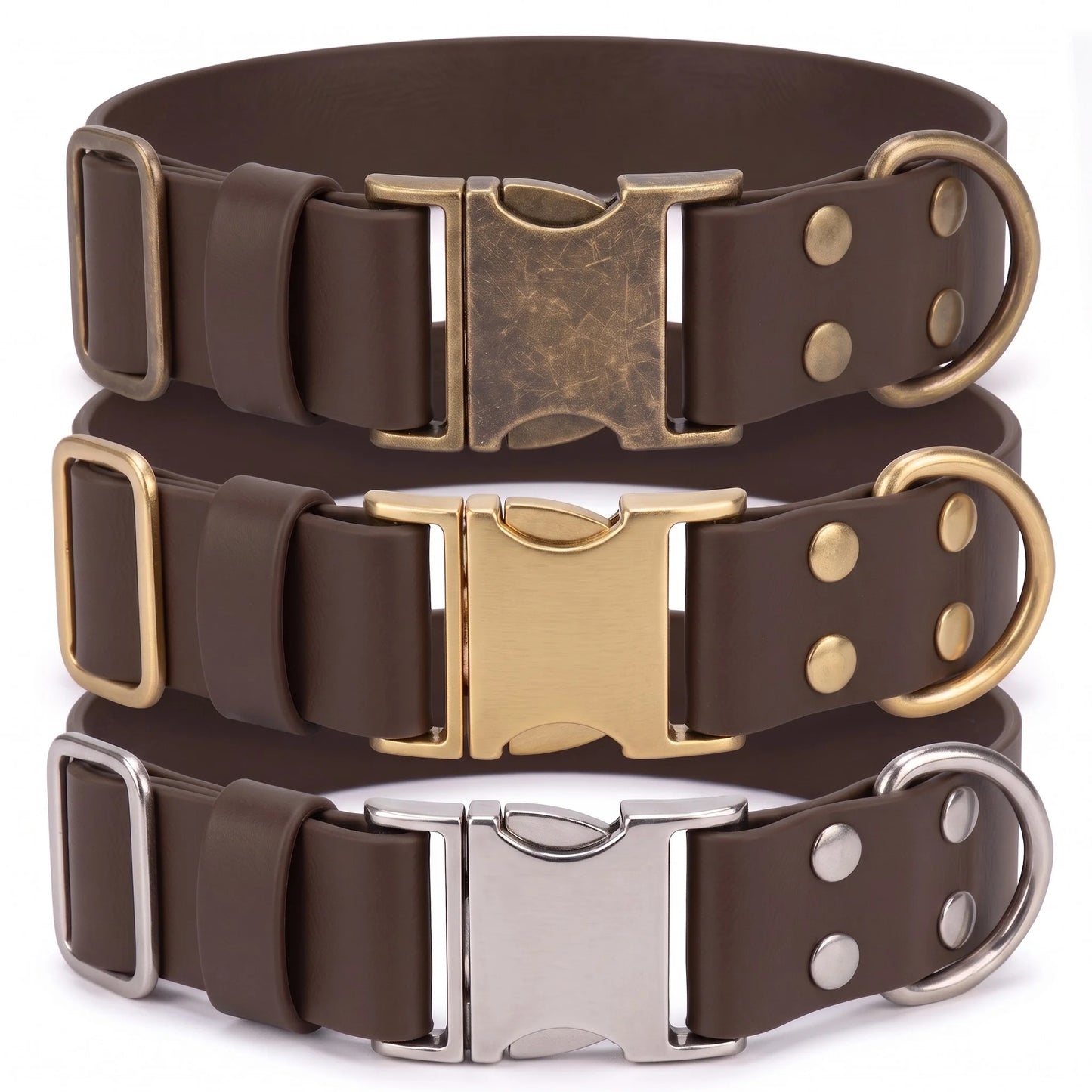 Three dark brown biothane dog collars stacked vertically, each with a different metal buckle and D-ring finish: antique bronze, gold, and silver.