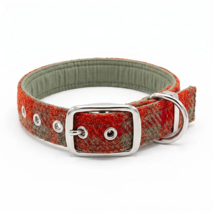 A woven harris tweed dog collar with a textured red and olive plaid pattern, a sage green padded interior, and a silver-tone metal buckle and D-ring, shown on a white background.